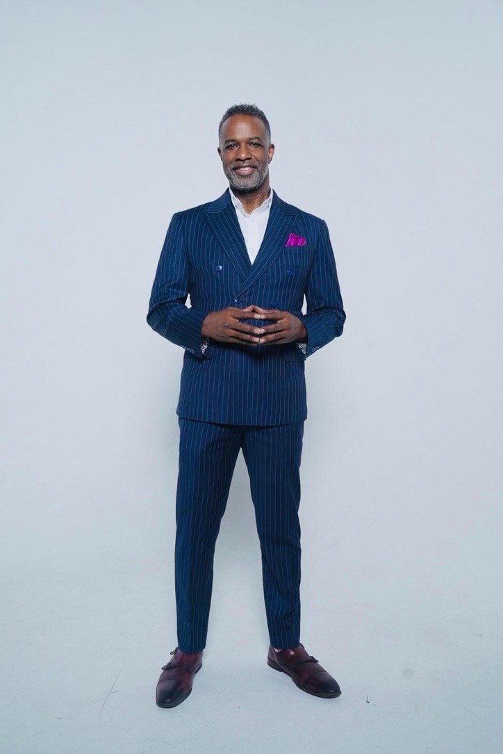 Gerry Watkins in a navy pinstripe suit